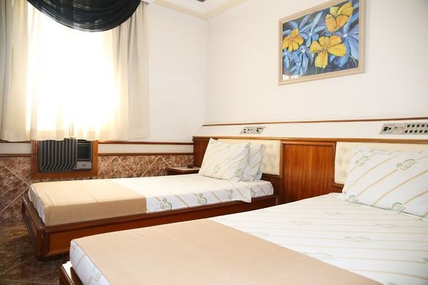 Quarto duplo com 2 camas de solteiro