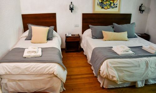 furniture,comfort,building,pillow,azure,bed frame,wood,textile,table,interior design,room