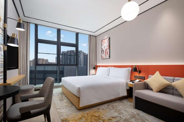 Habitación Deluxe con cama extragrande y sofá cama