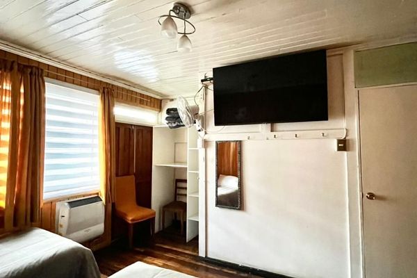 Habitación triple con baño compartido