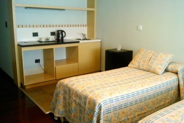 Suite Familiar (1 Cama King + 3 individuales)