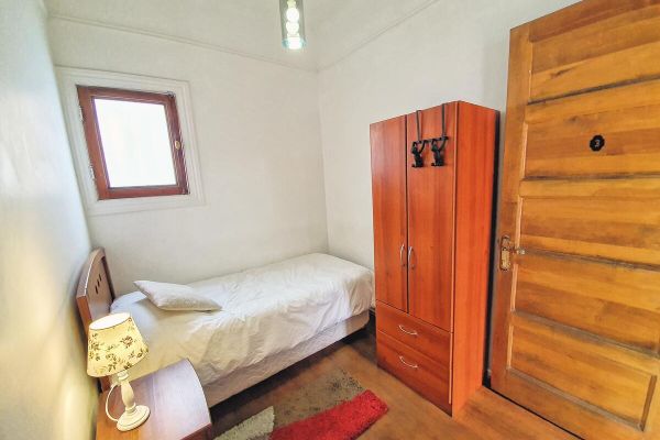 Habitación Individual con Baño Compartido