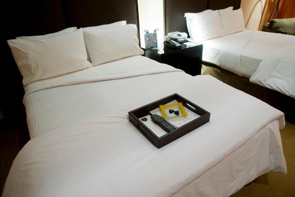 Habitación superior con 2 camas queen  y vista al jardin