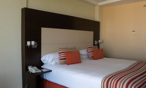 furniture,property,comfort,building,fixture,wood,textile,bed,interior design,shade,room